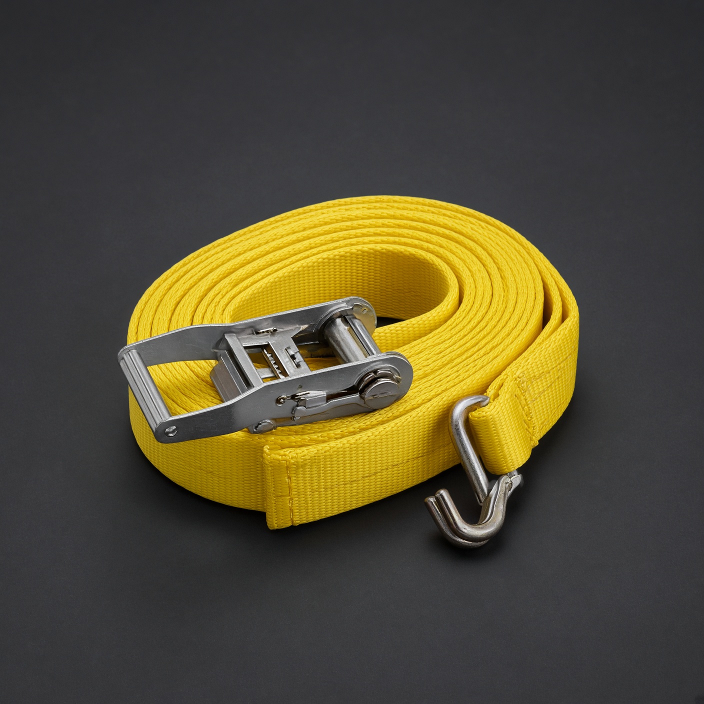 Coiled yellow ratchet strap